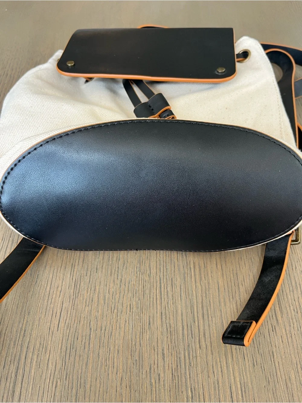 Treasure & Bond Canvas Backpack with Black Leather Flap and Tan Trim
